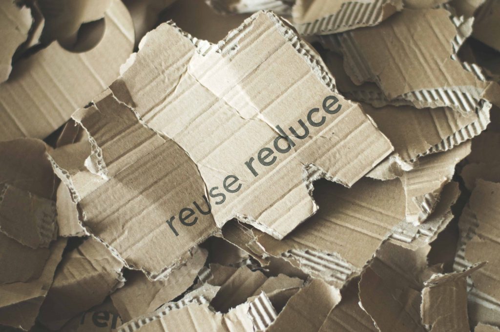 Canva Photo Of Pile Of Ripped Carton Scaled - eco-friendly cleanup Genesis Removal